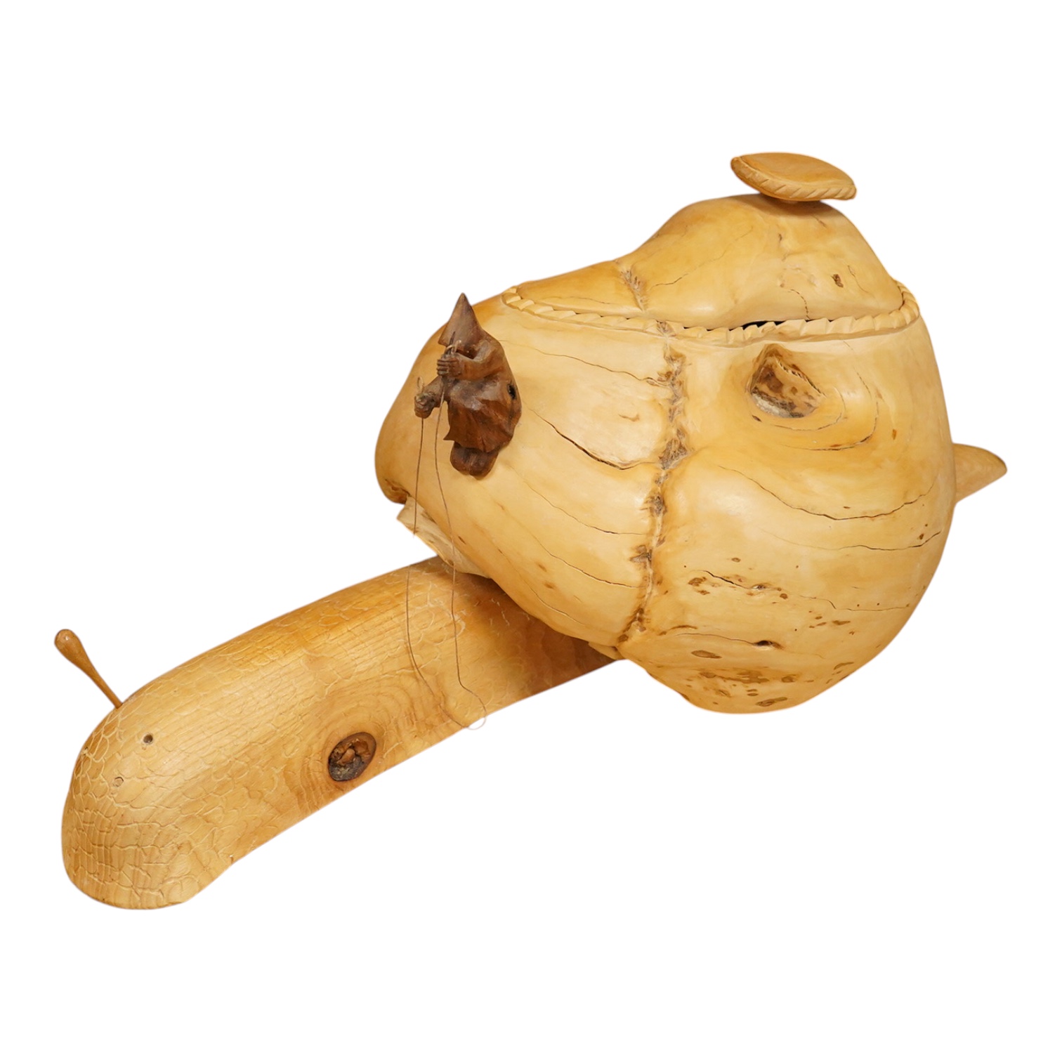 Pierre Decorse (b.1953), a naturalistically modelled wooden sculpture depicting a figure riding a snail, 53cm long